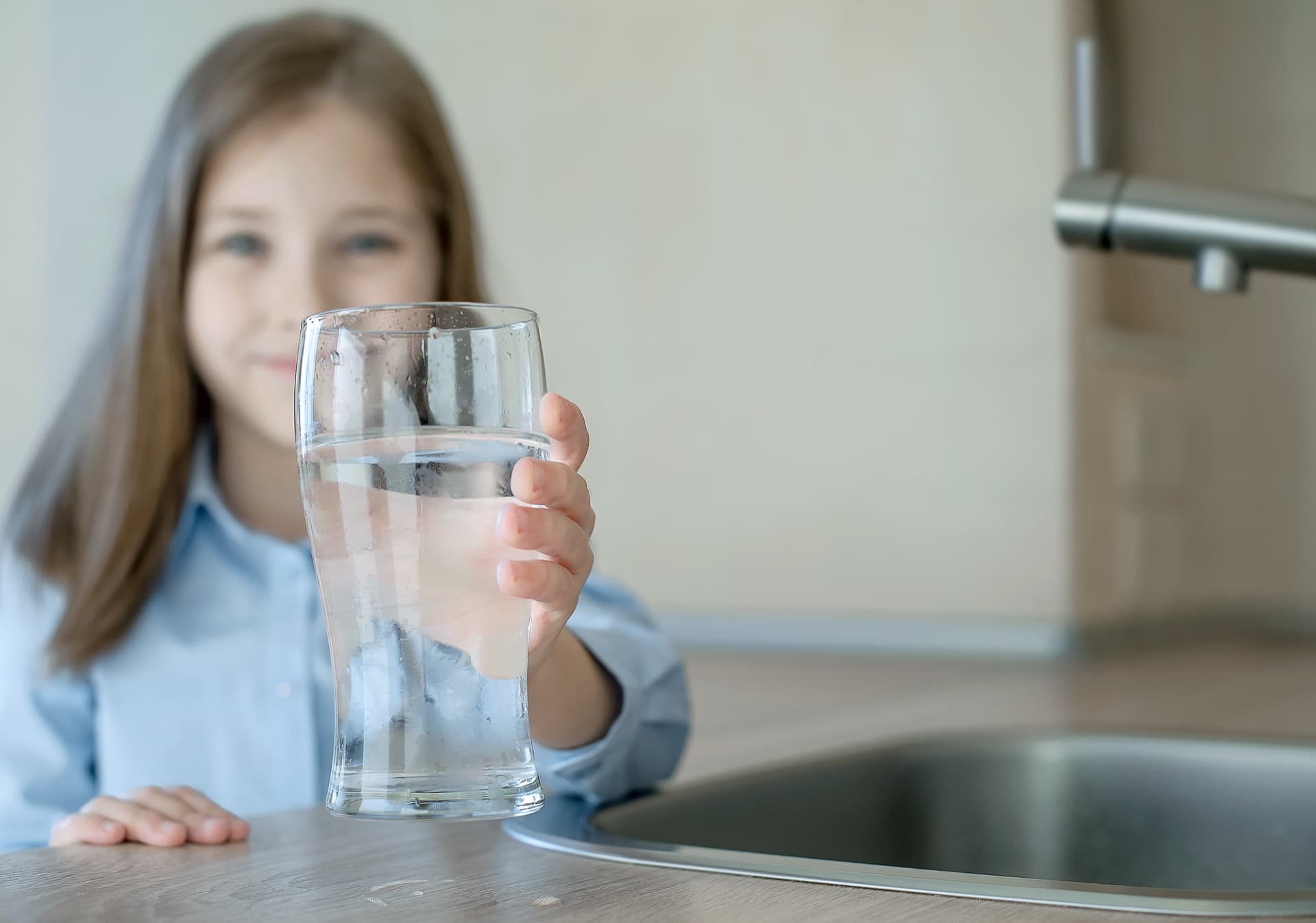 Phoenix homeowner drinking filtered water